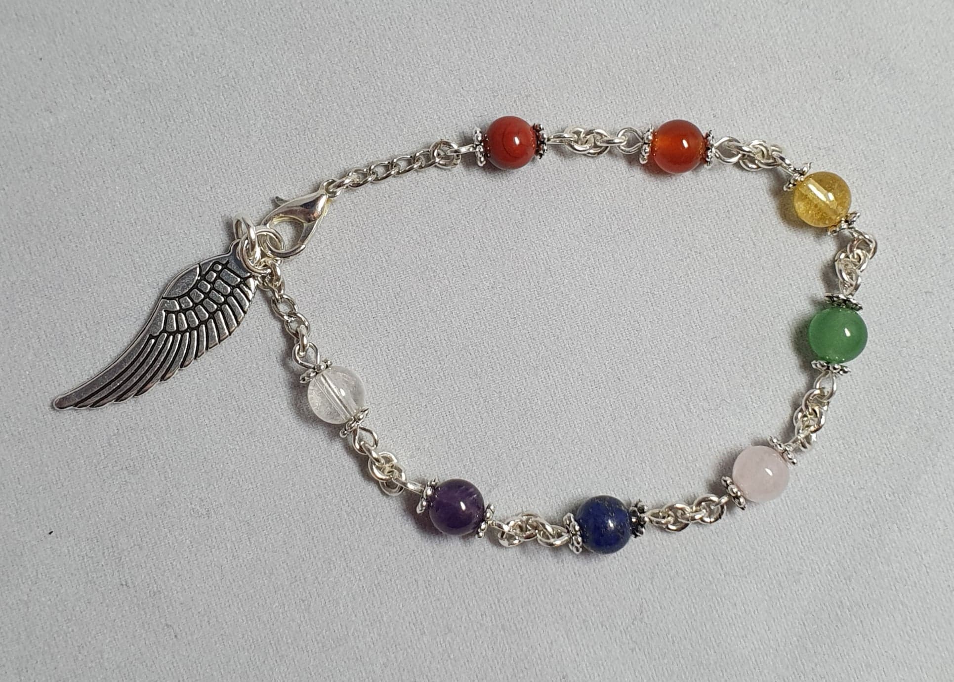 Chakra bracelet, silver colour chain and charm