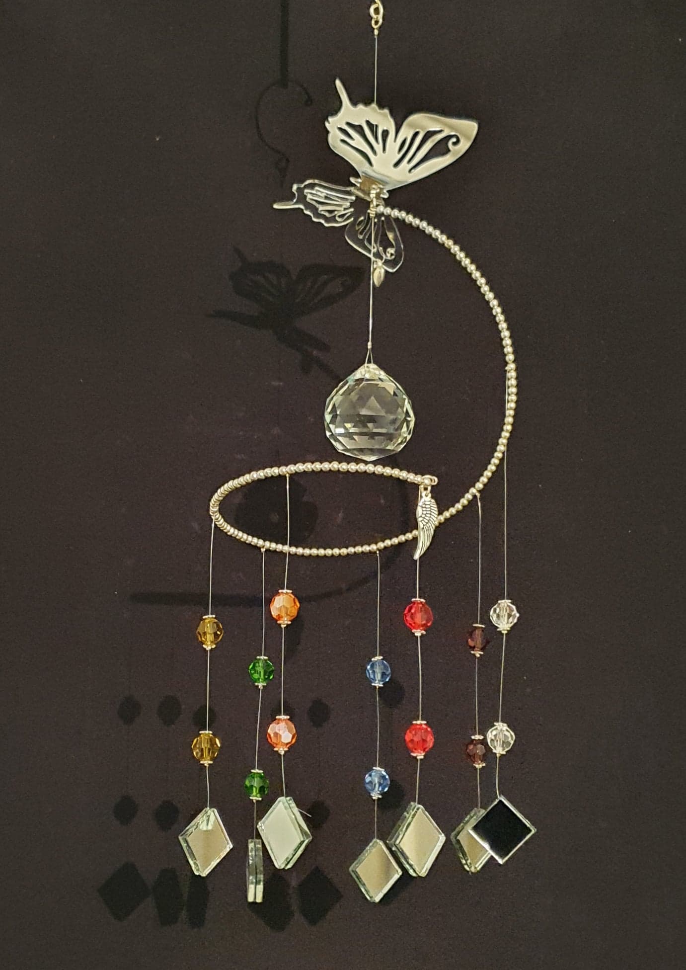 Butterfly theme spiral suncatcher. Rainbow/chakra colour glass crystals.