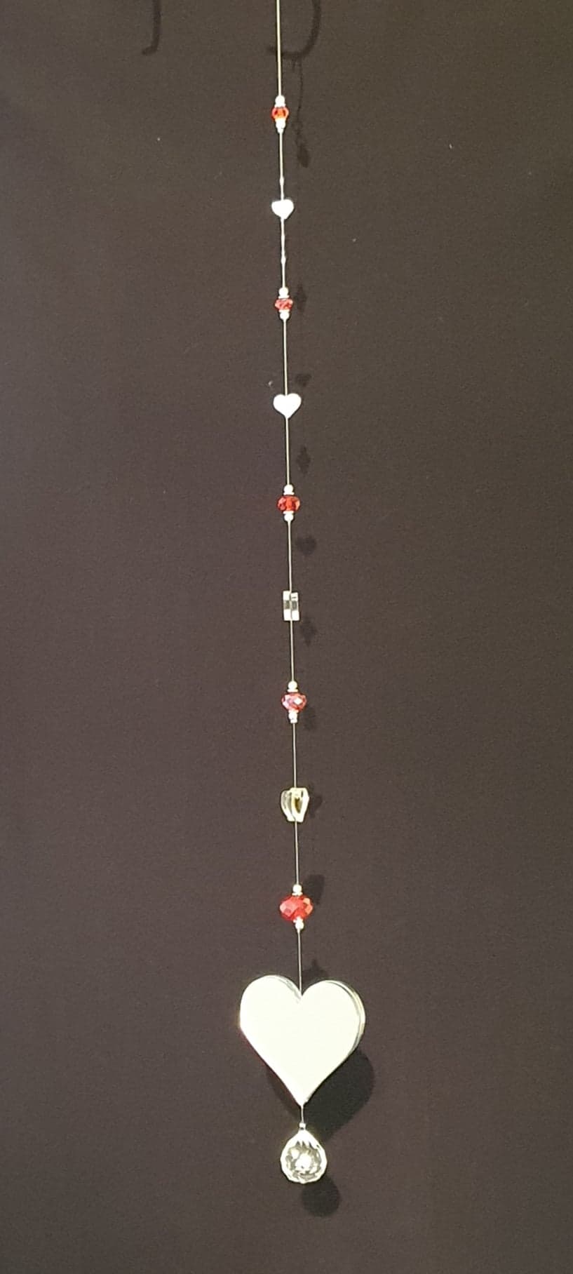 Heart mirrors with red faceted glass crystals. Single drop suncatcher